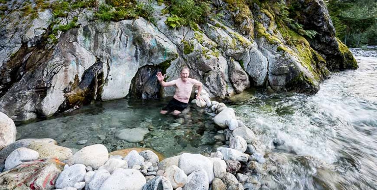 Nakusp's Halfway Hot Springs are a series of three natural pools located in a riverbed, fed by a waterfall.