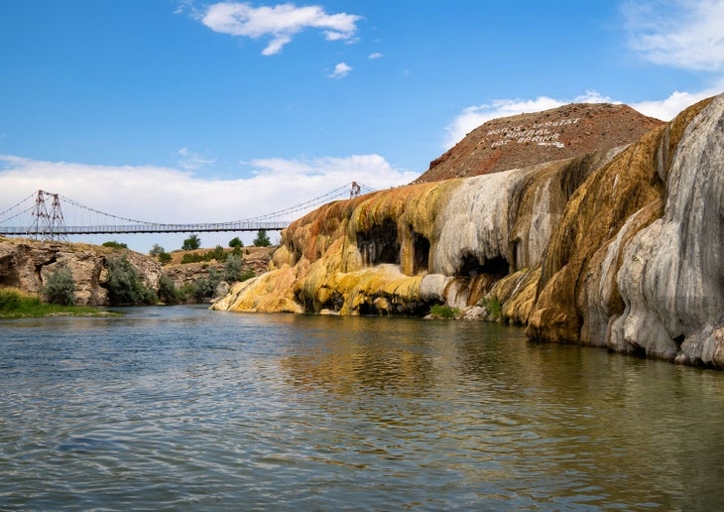 There are several hot springs located near Yellowstone National Park, including Thermopolis, which is just over 180 miles away.